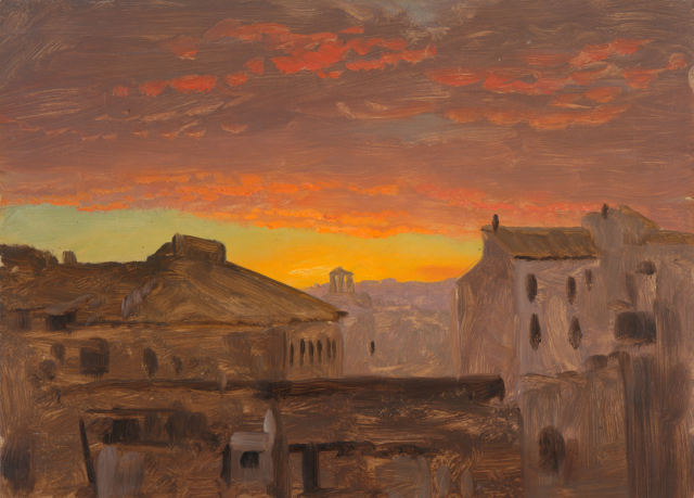 View of Rome looking down upon houses. Pink and golden cloudy skies.