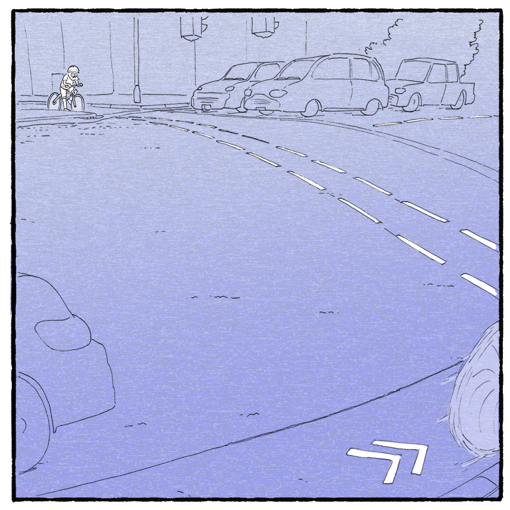 The artist approaches a busy road. He’s tiny next to the cars.