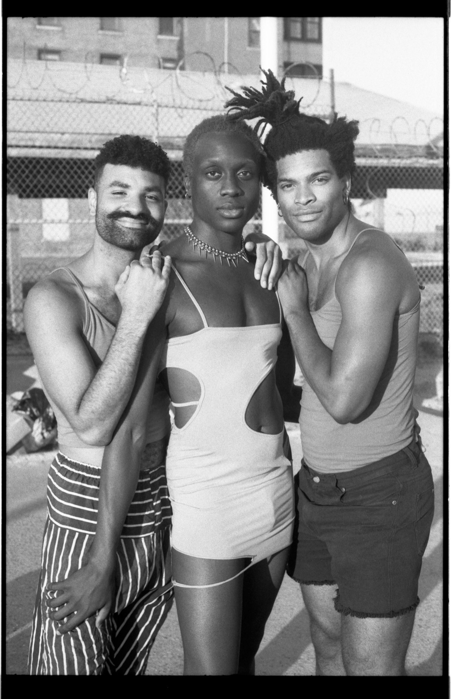 From left to right: Kyle Carrero Lopez, Basit Shittu, and Garrett Allen pose in front of the abandoned Neponsit Beach Hospital at Riis beach.